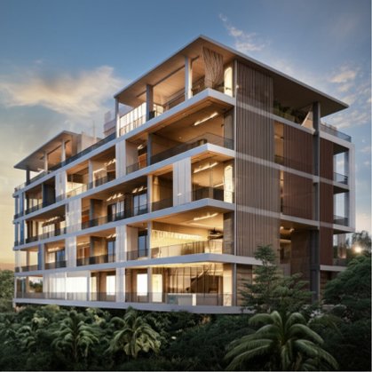 A modern, multi-story residential complex under construction in Jaipur, featuring a contemporary design with exposed structural elements, large balconies, and lush surrounding greenery under a warm evening sky.